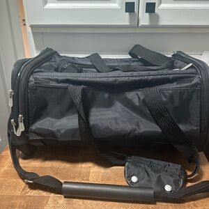 Black pet carrier/travel with wheels